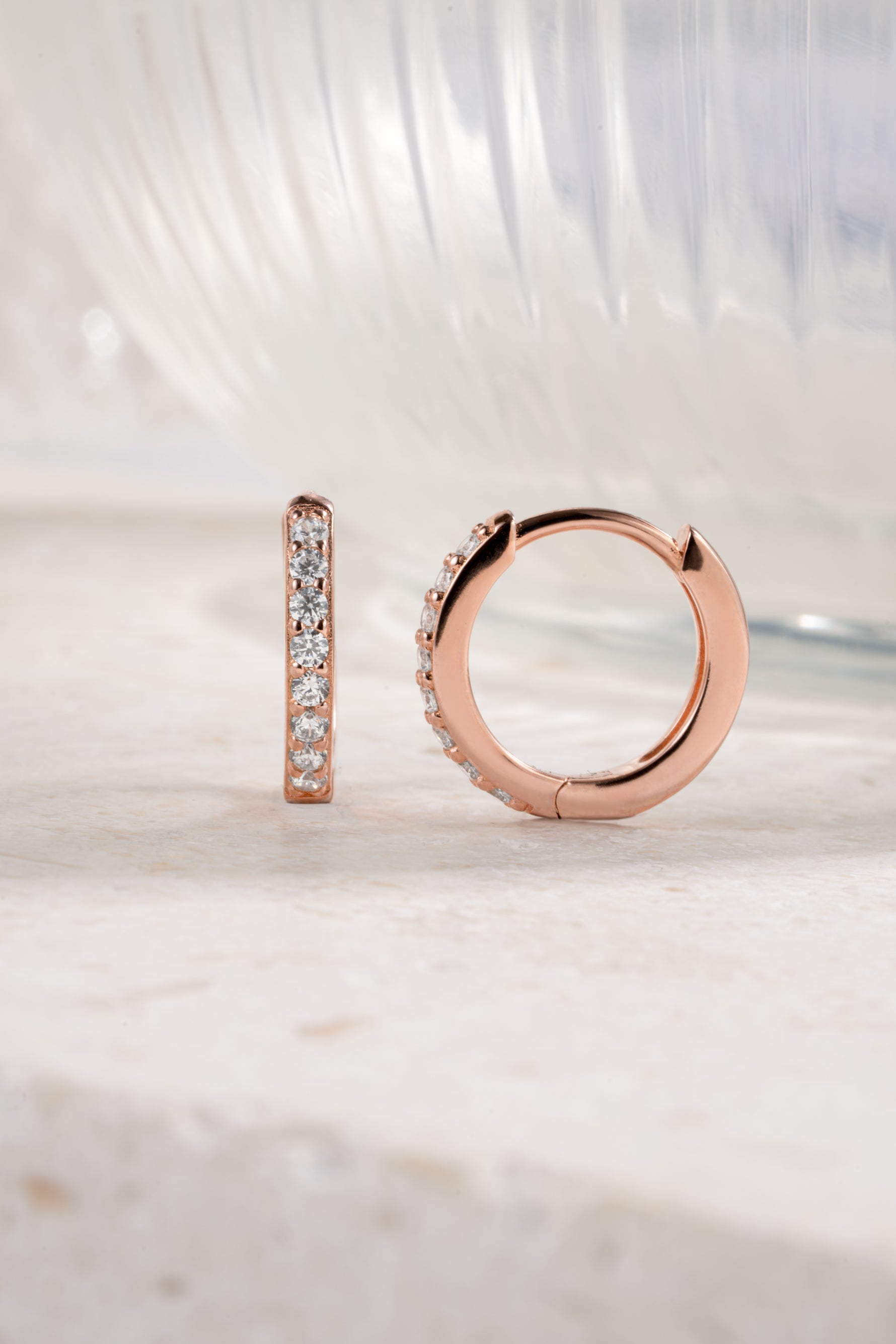 rose gold 11mm studded huggie hoop neutral background