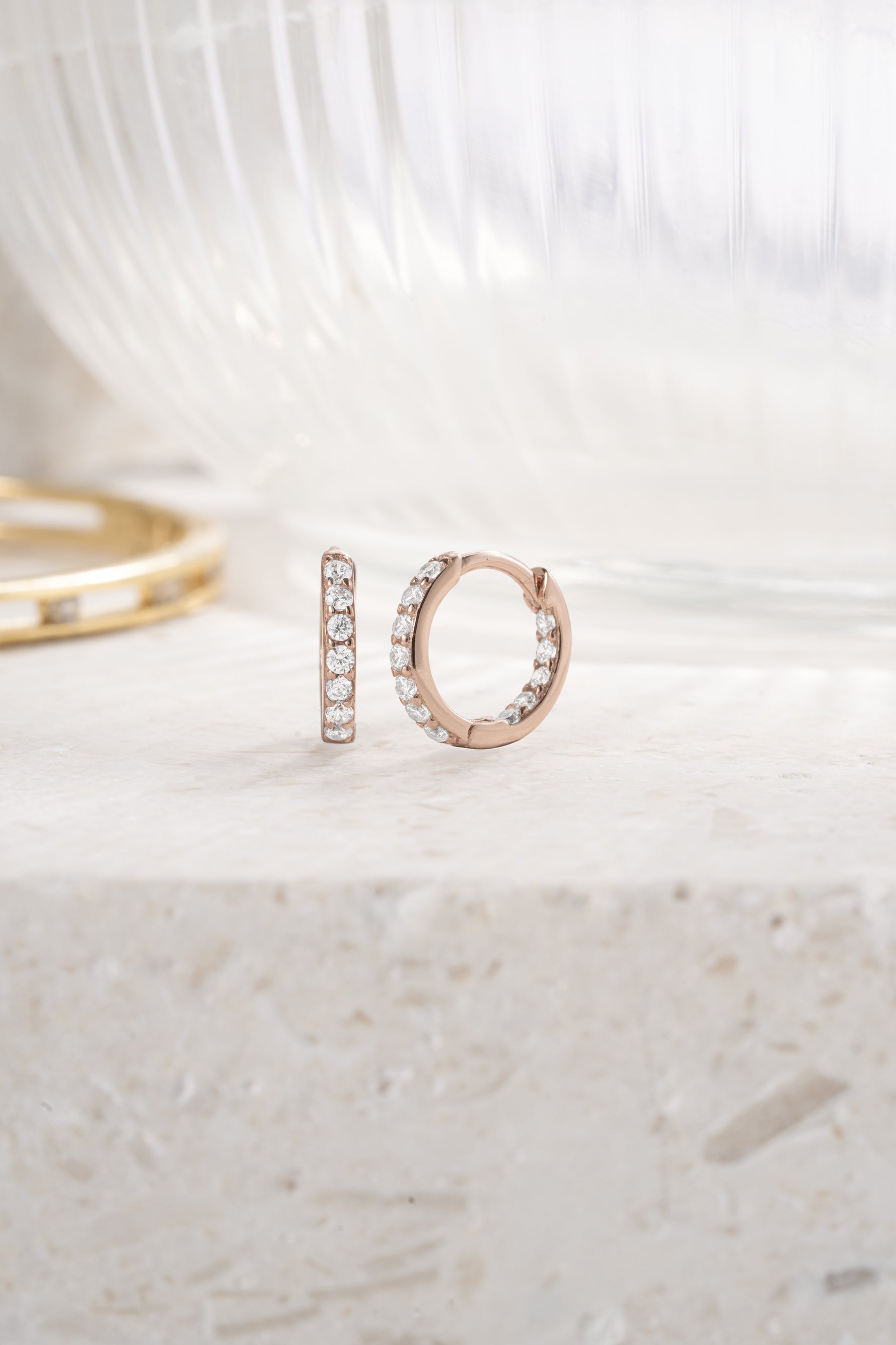 rose gold 9mm in and out studded huggie hoop simple background