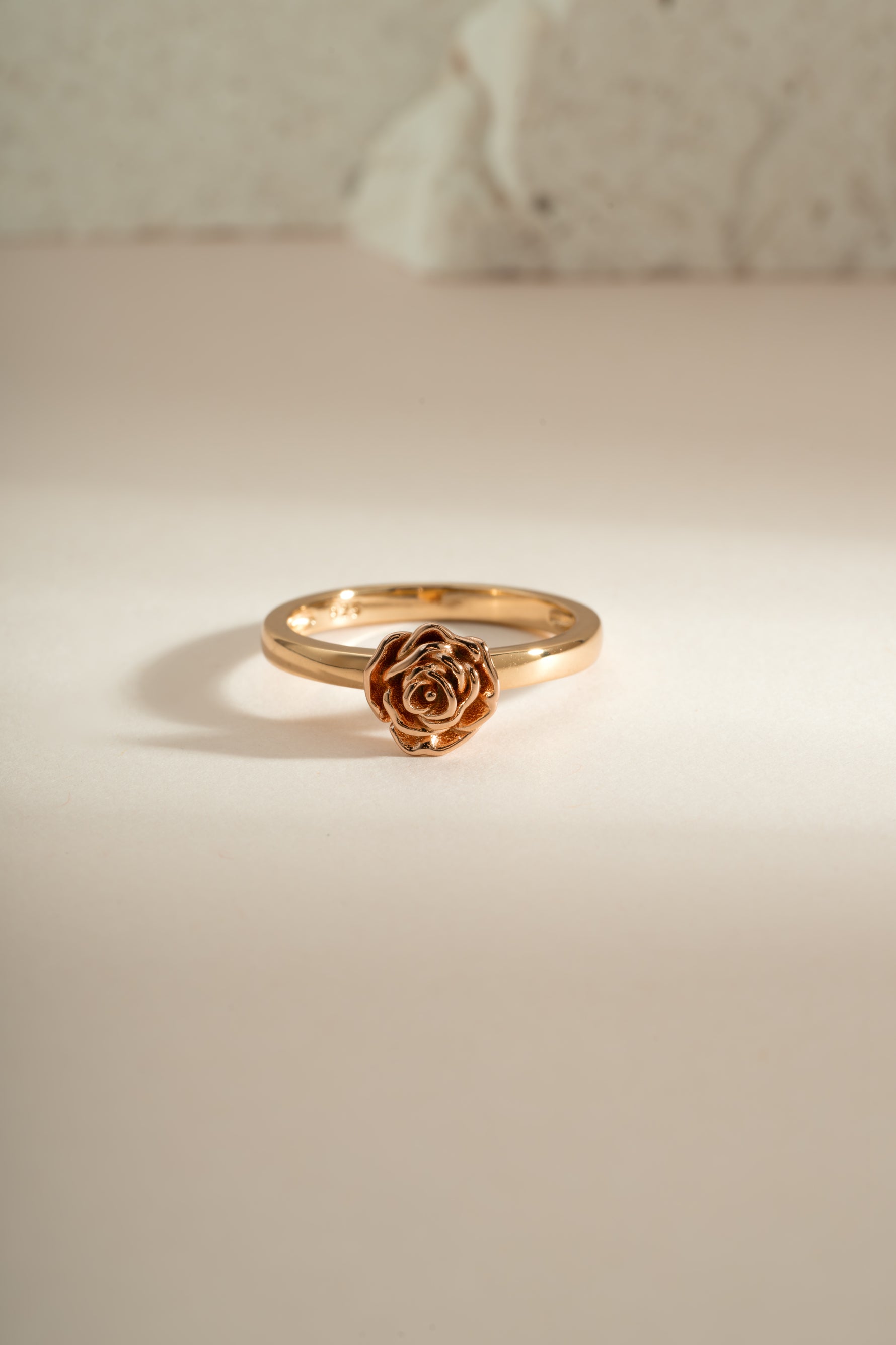 Gold rose ring by Sami Jewels featuring a detailed rose design, shown from the front view.