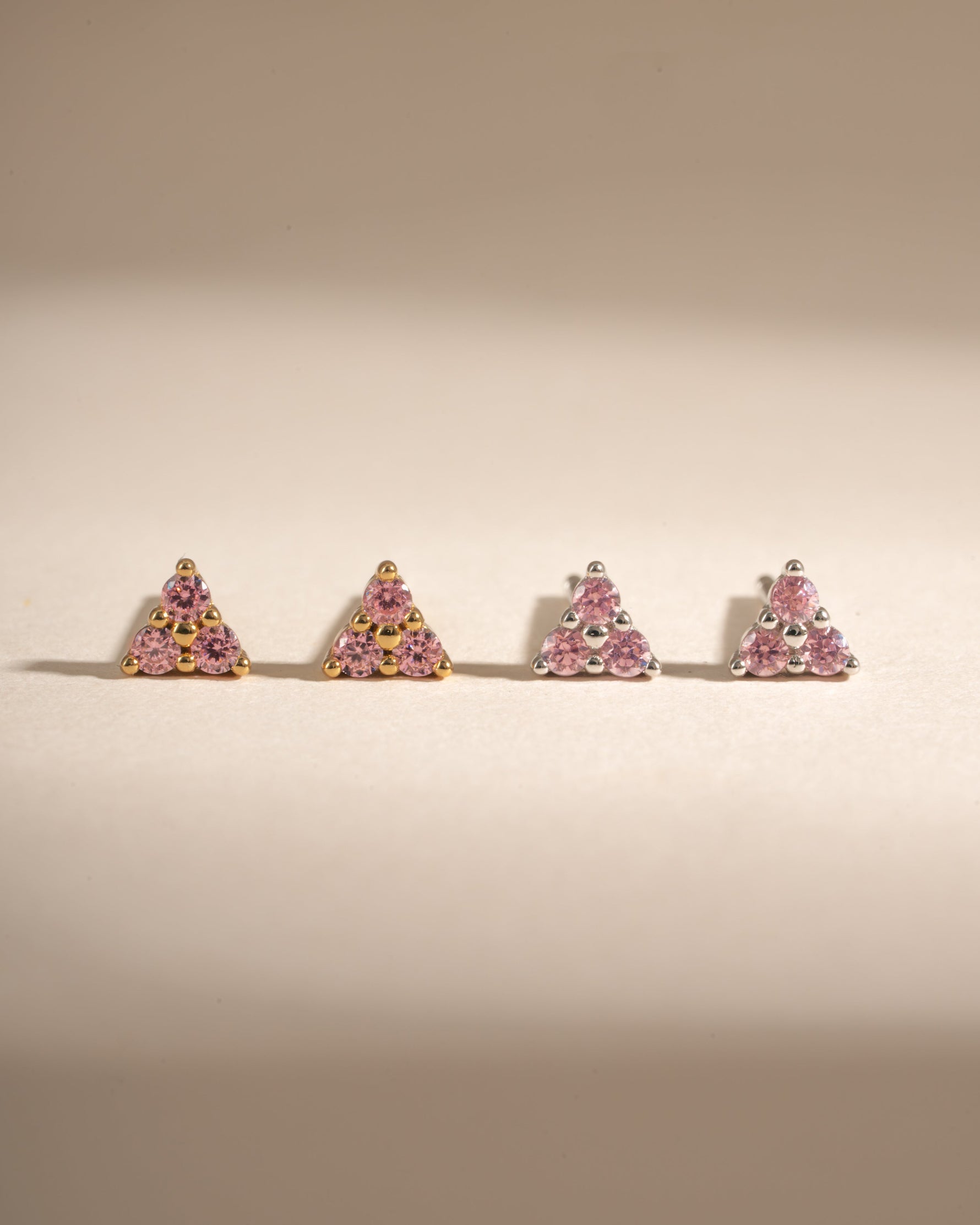Sami Jewels Tiny Rose 3 Stone Stud Earrings in gold and sterling silver with small rose-shaped stones.