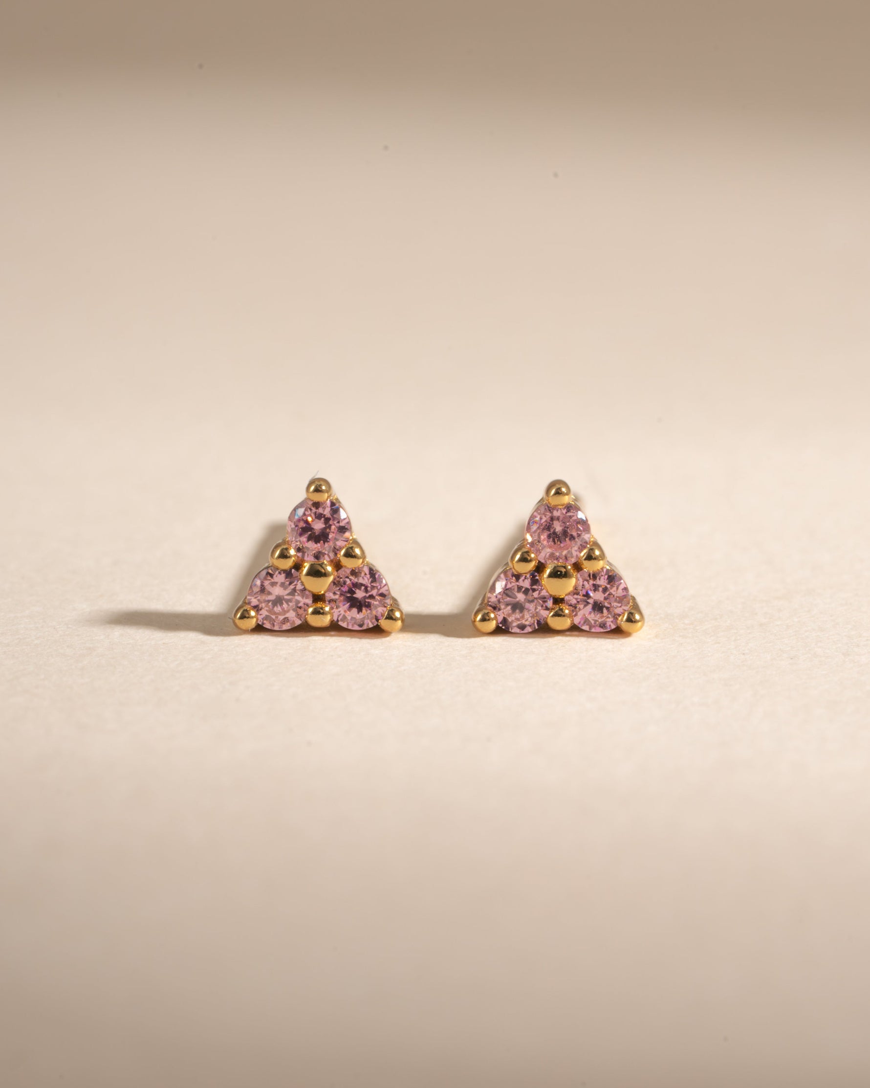 Gold Tiny Rose 3 Stone Stud Earrings by Sami Jewels featuring delicate rose-shaped design and sparkling stones.