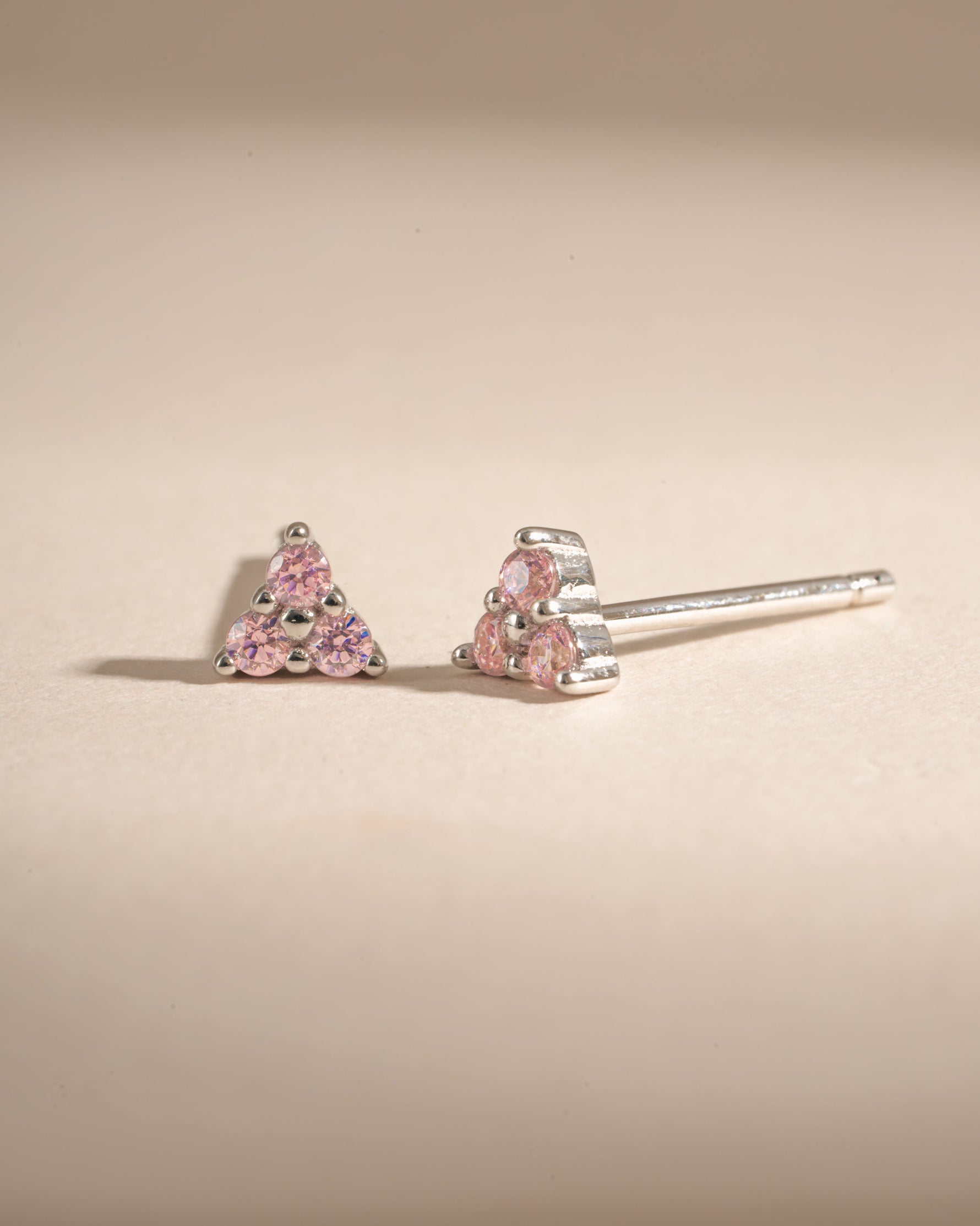 Sterling silver Tiny Rose 3 Stone Stud Earrings by Sami Jewels featuring small rose-shaped design with three sparkling stones.