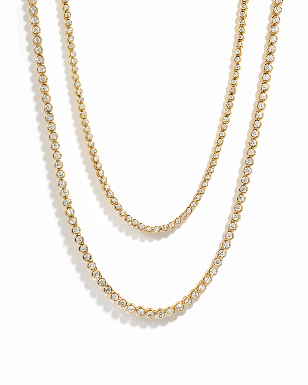 Gold Round Bezel Tennis Necklace with 2.5mm and 3mm diamonds by Sami Jewels, showcasing a sleek, elegant design.