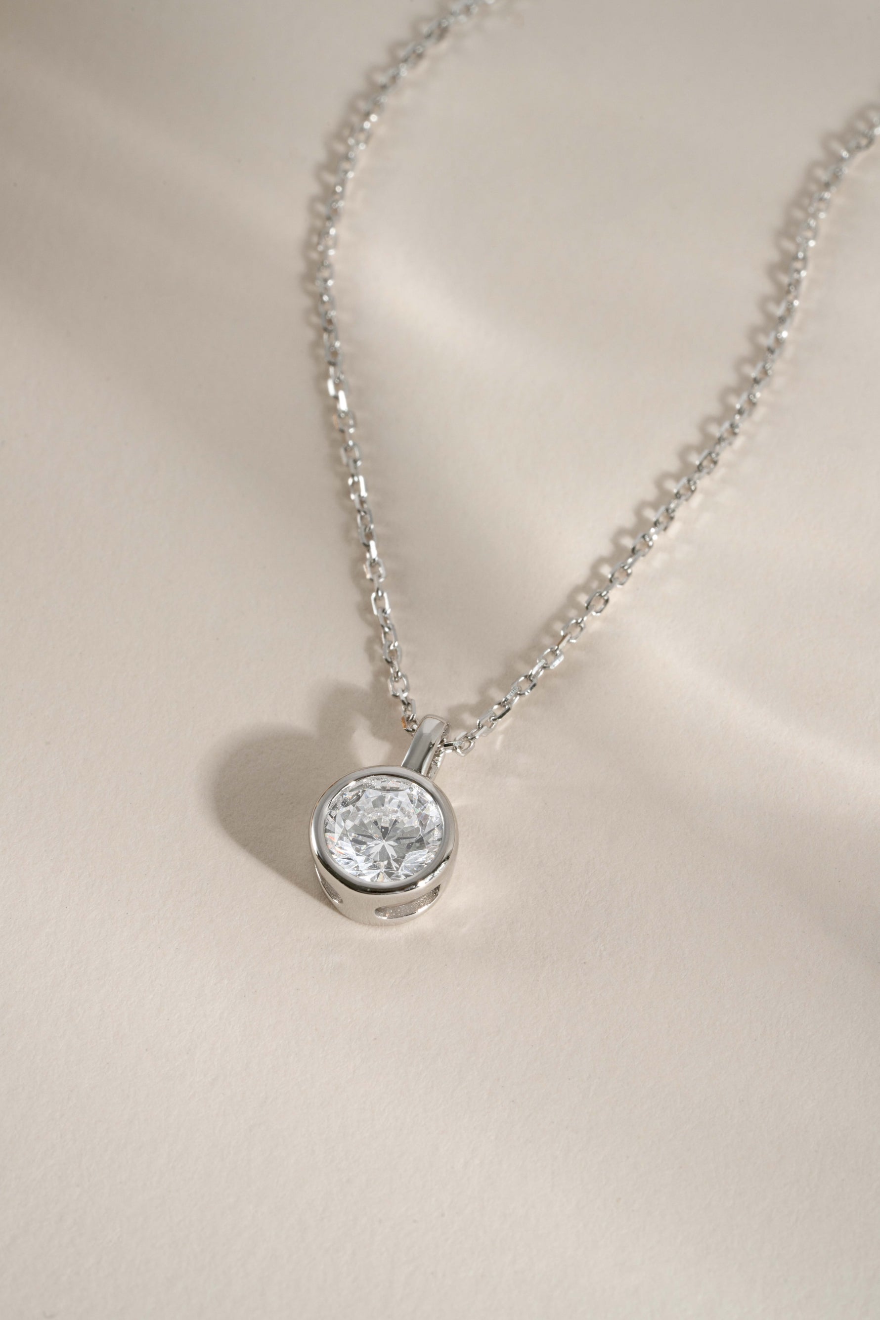 Round bezel pendant necklace from Sami Jewels, featuring a sleek circular design perfect for bridal or elegant occasions.
