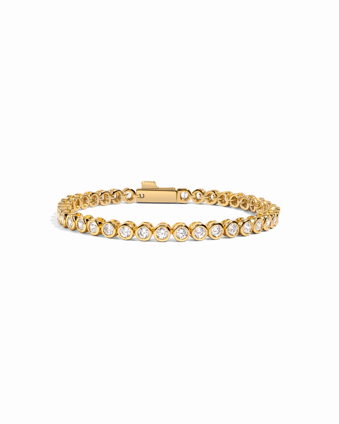 Gold 3mm round bezel tennis bracelet by Sami Jewels, featuring a sleek design on a white background.