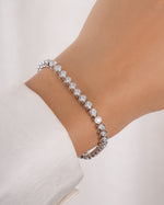 round bezel diamond tennis bracelet, 3mm in silver on a models wrist