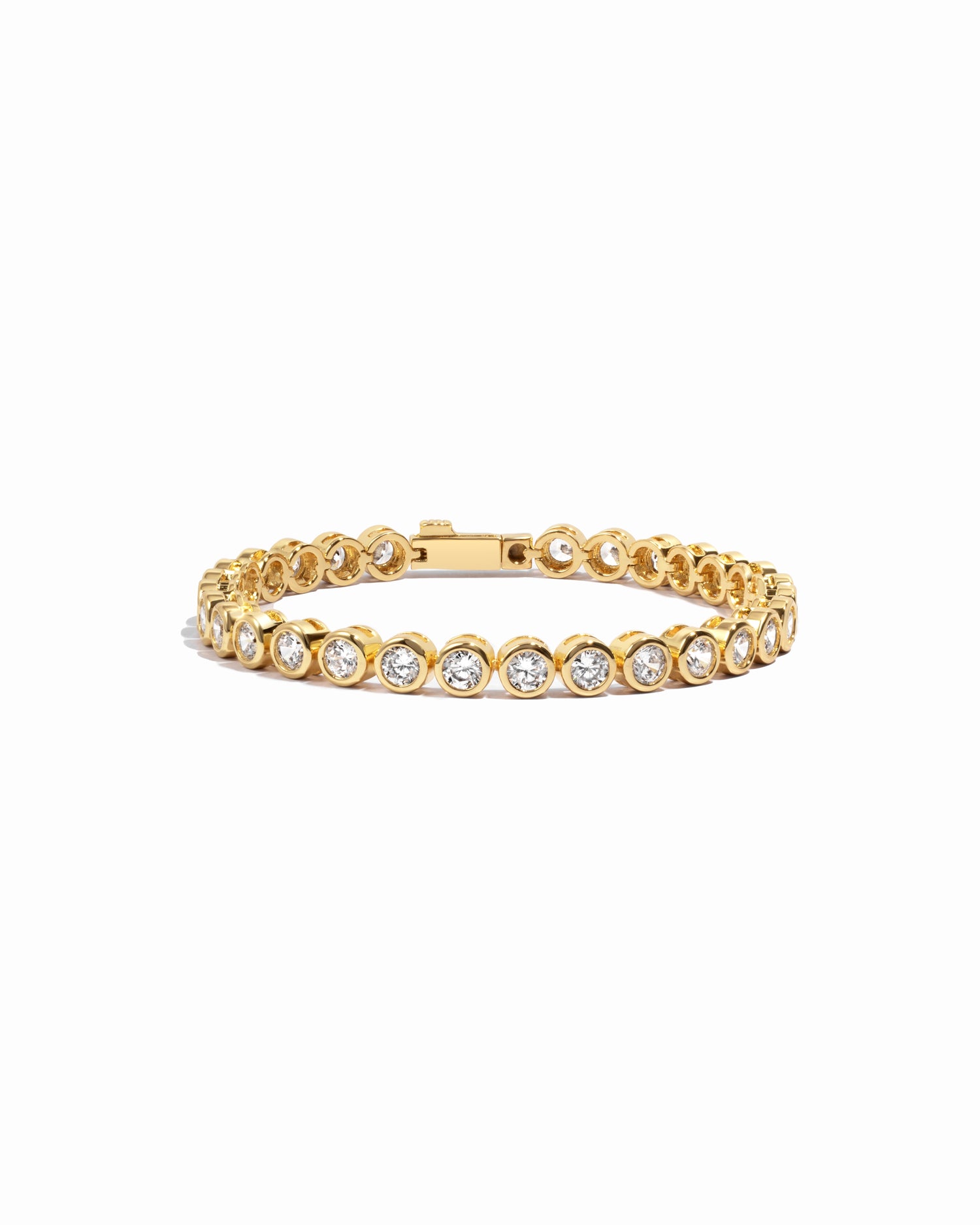 round bezel diamond tennis bracelet in 4mm gold on a white background