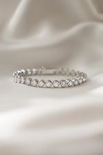 round bezel diamond tennis bracelet in 4mm in silver closeup front view 