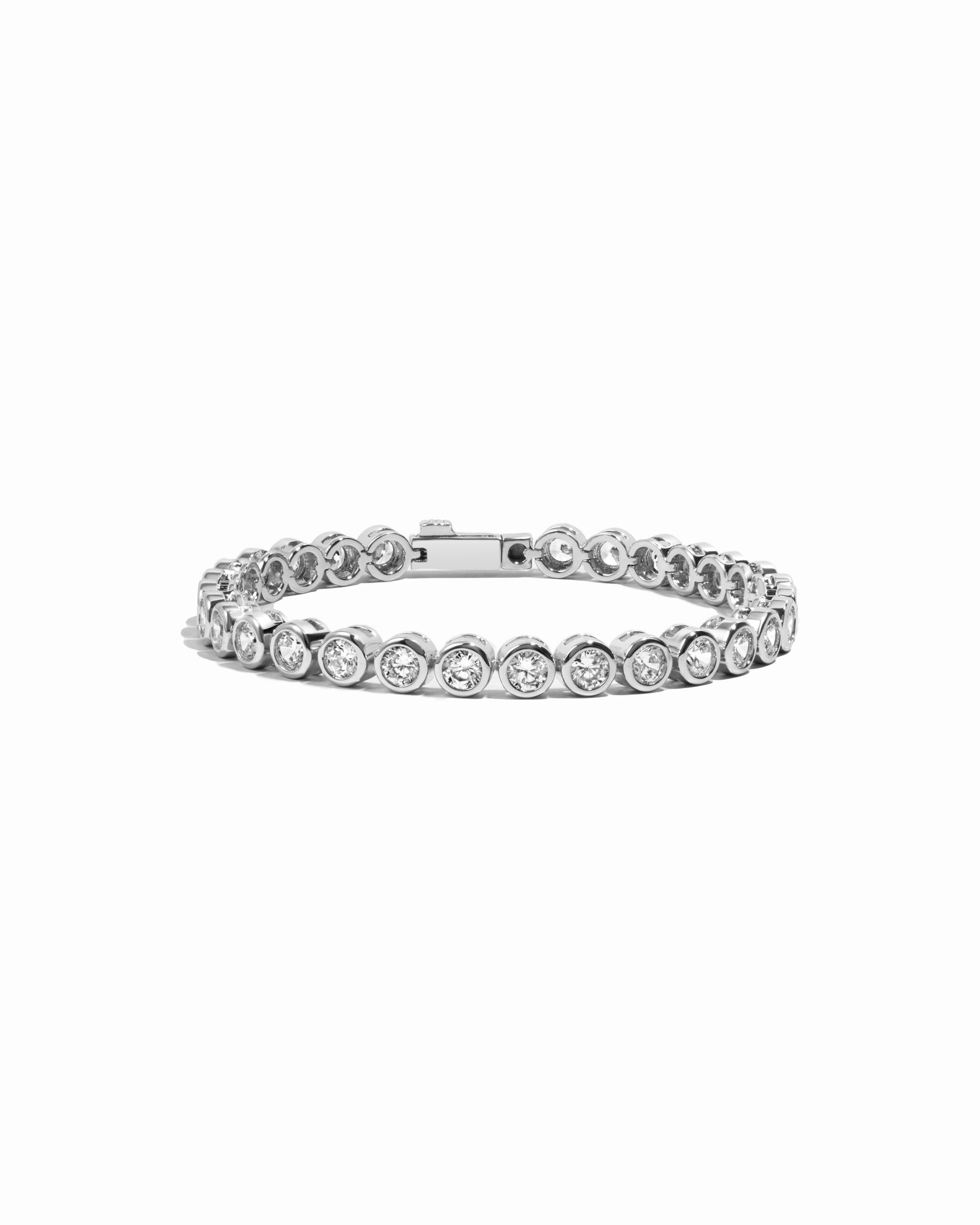 round bezel diamond tennis bracelet in 4mm silver on white background