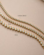 Gold 4mm round bezel tennis bracelet from Sami Jewels showcasing a sleek, elegant design with evenly spaced round bezels.