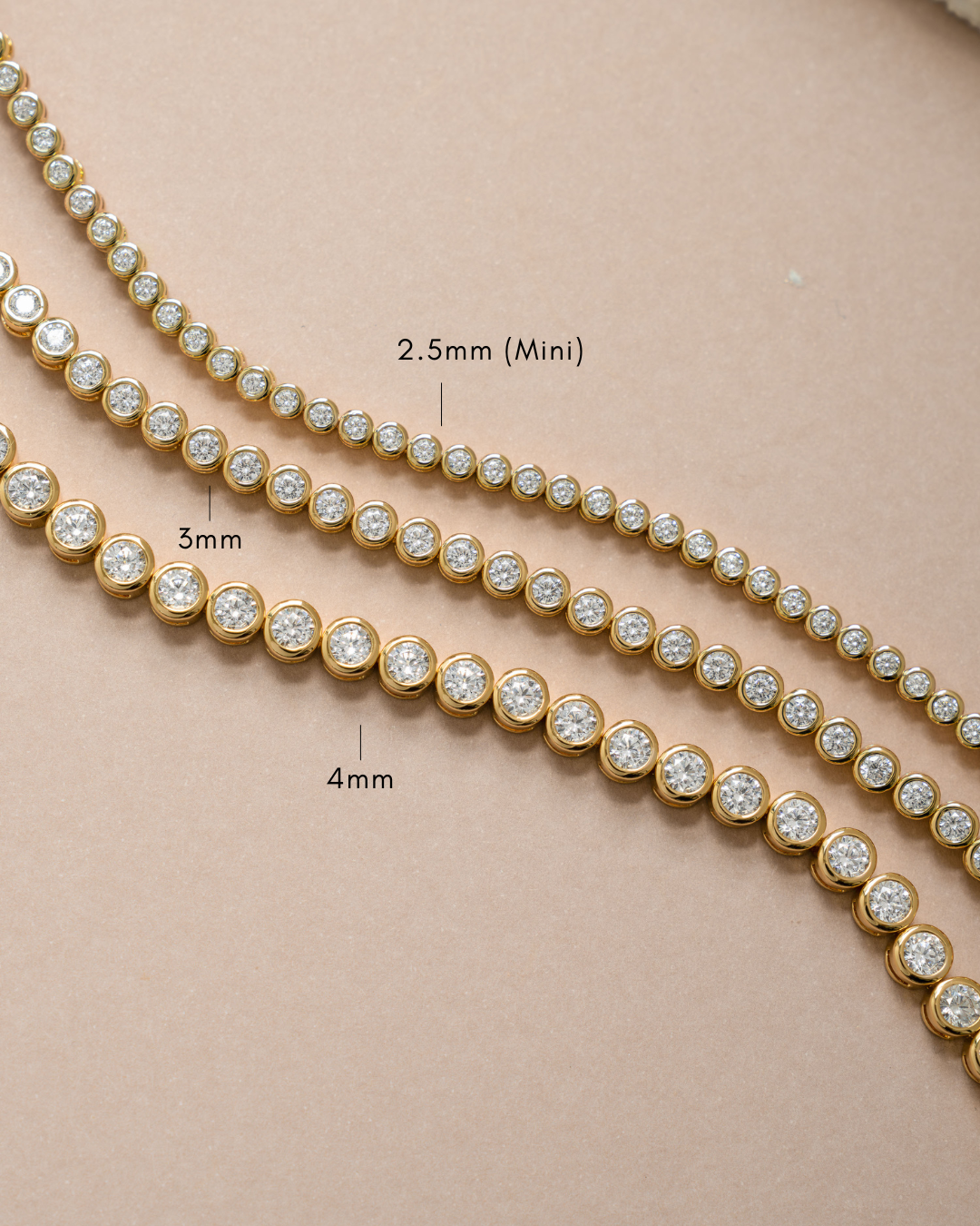 Gold 4mm round bezel tennis bracelet from Sami Jewels showcasing a sleek, elegant design with evenly spaced round bezels.