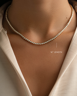 Gold 2.5mm round bezel tennis necklace by Sami Jewels, 16-inch length, featuring a delicate and elegant design.