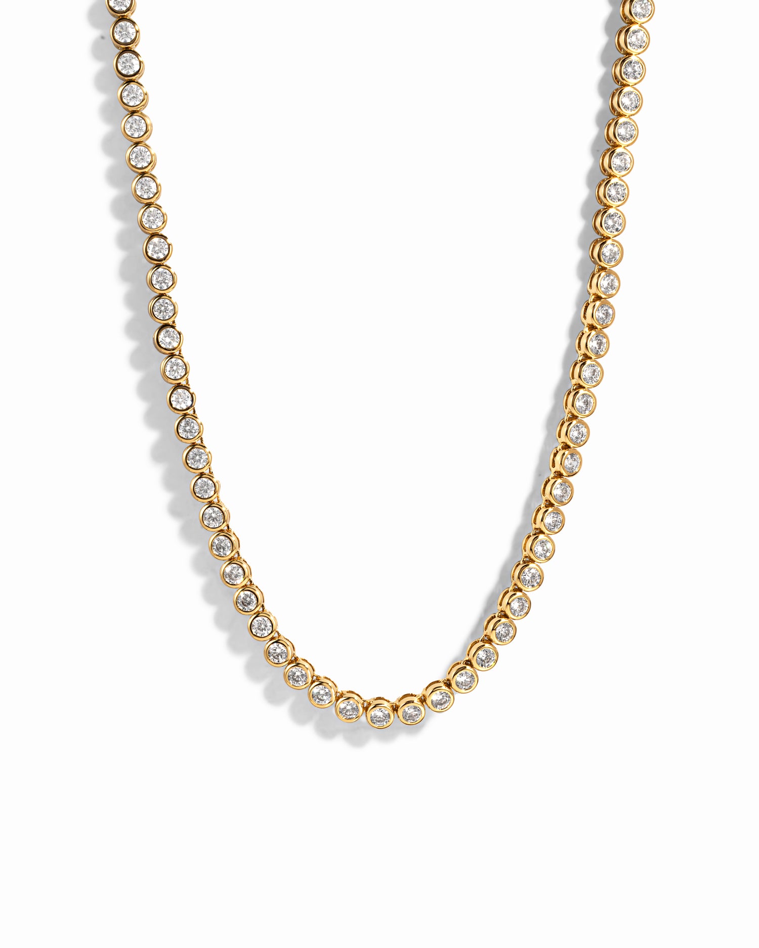 Gold 3mm round bezel tennis necklace by Sami Jewels featuring a sleek, elegant design against a white background.