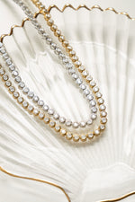 Gold and silver Sami Jewels 3mm round bezel tennis necklace with a sleek, elegant design.