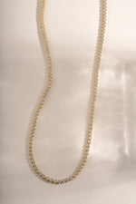 Gold round bezel tennis necklace bundle by Sami Jewels featuring a classic chain design and sparkling gemstone accents.