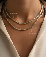Gold 2.5mm round bezel tennis necklace by Sami Jewels, featuring a sleek design in varying lengths.