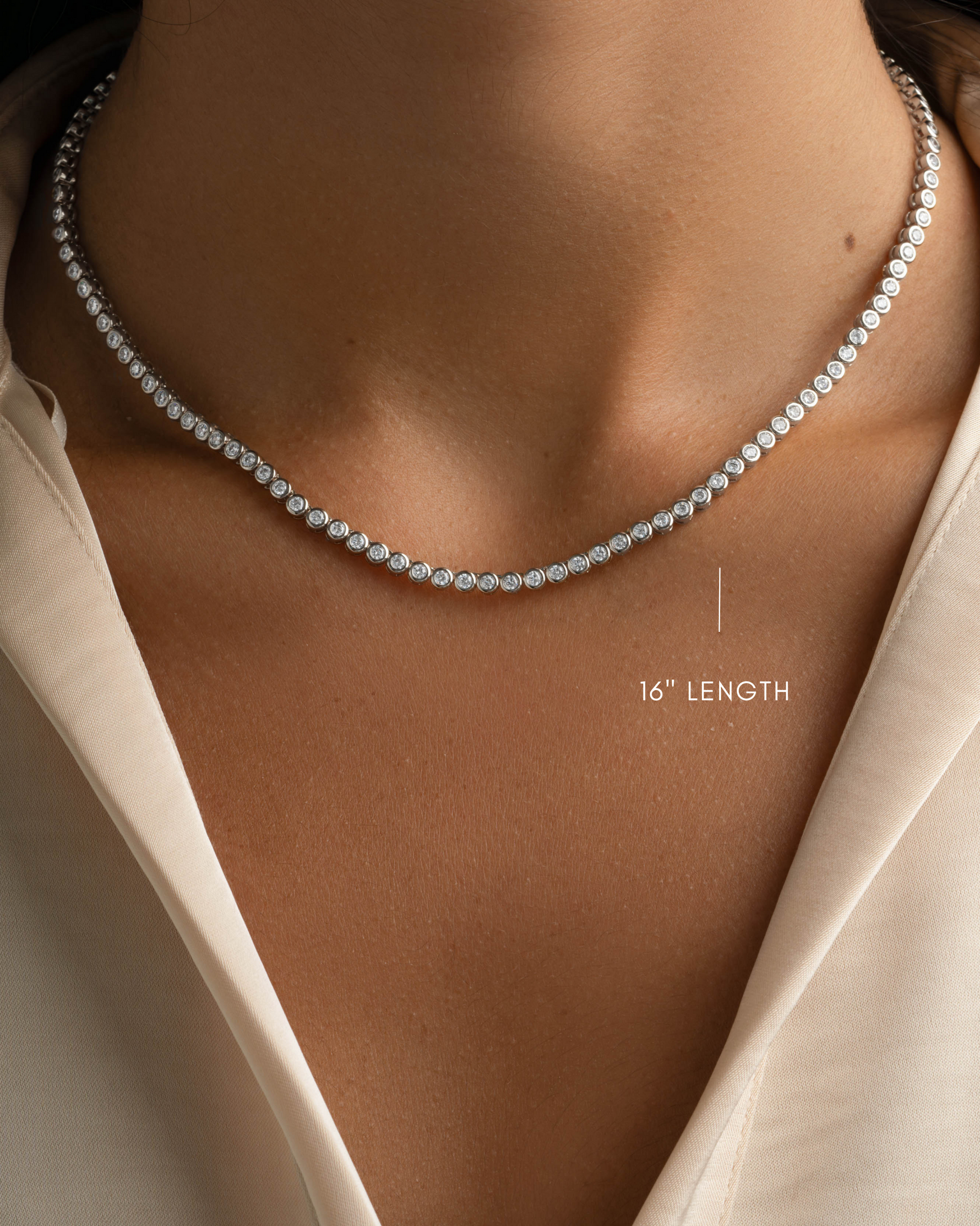 Silver 2.5mm round bezel tennis necklace by Sami Jewels, 16-inch length, featuring a sleek, elegant design.