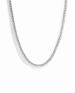 Silver 2.5mm round bezel tennis necklace by Sami Jewels displayed on a white background.