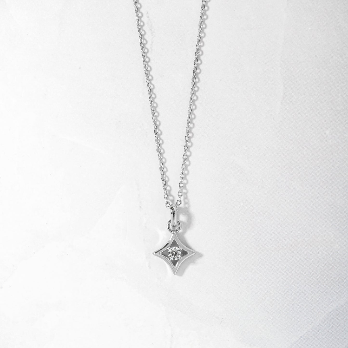 silver diamond pendant with round cz