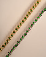 Detail of bezel-set round green stones on emerald tennis necklace, view 6