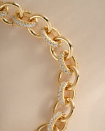 Close-up of Sami Jewels round pave link chain bracelet in gold, showcasing sparkling pave details and intricate link design.