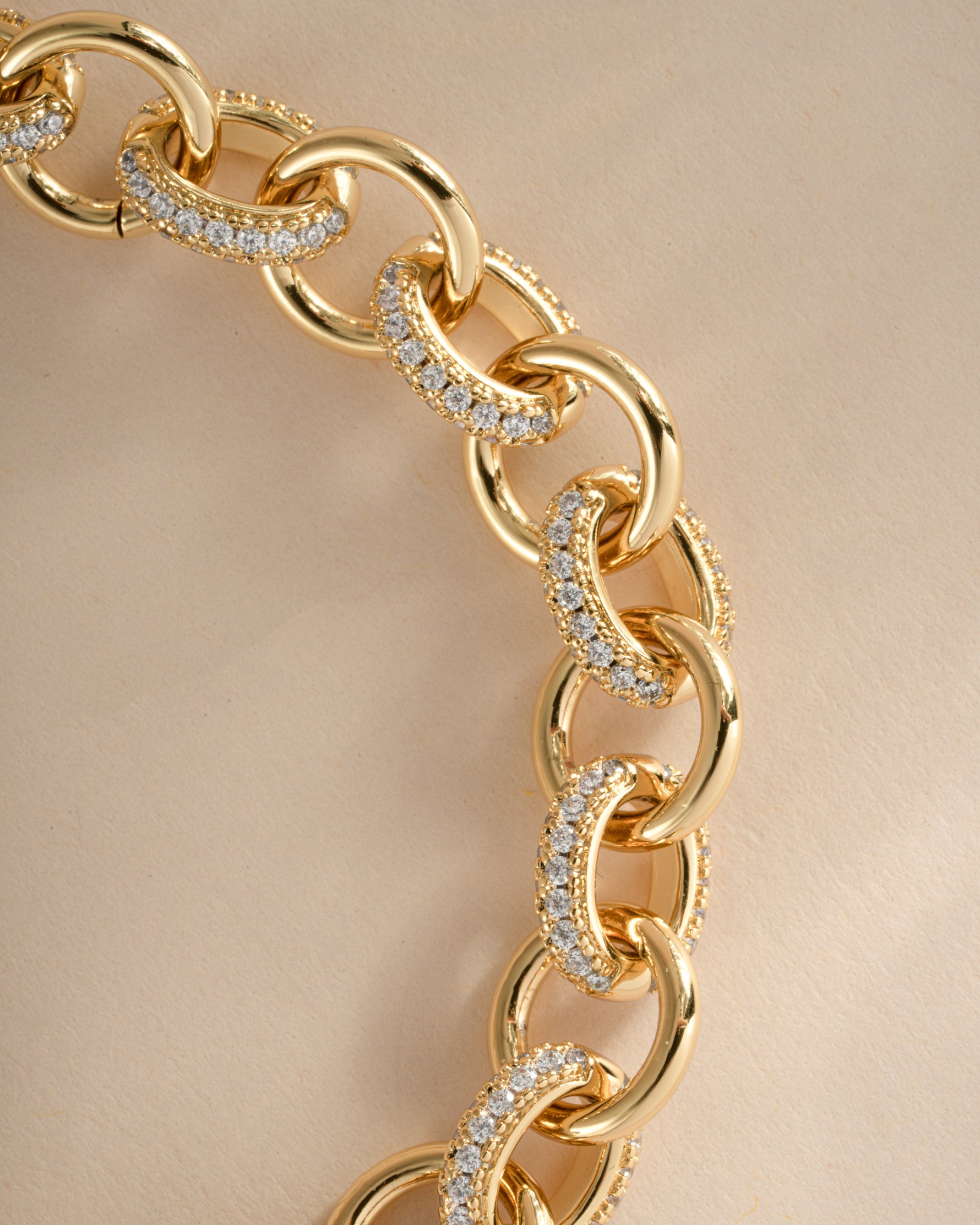 Close-up of Sami Jewels round pave link chain bracelet in gold, showcasing sparkling pave details and intricate link design.