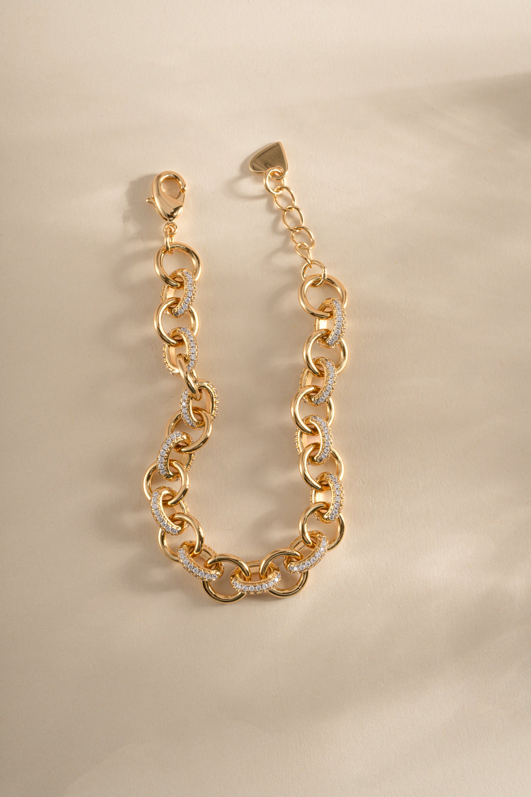 Gold Sami Jewels round pave link chain bracelet with sparkling pave-set links and a secure clasp on a white background.