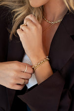 Gold Sami Jewels Round Pave Link Bracelet with sparkling pave details on round links, worn on a model's wrist.