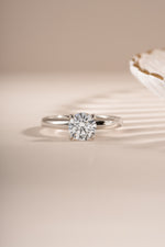 Close-up of Sami Jewels sterling silver round solitaire ring showcasing a single sparkling gemstone.