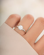 Sterling silver round solitaire ring from Sami Jewels featuring a single central gemstone on a sleek band.