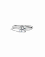 Sterling silver round solitaire ring by Sami Jewels displayed on a white background.