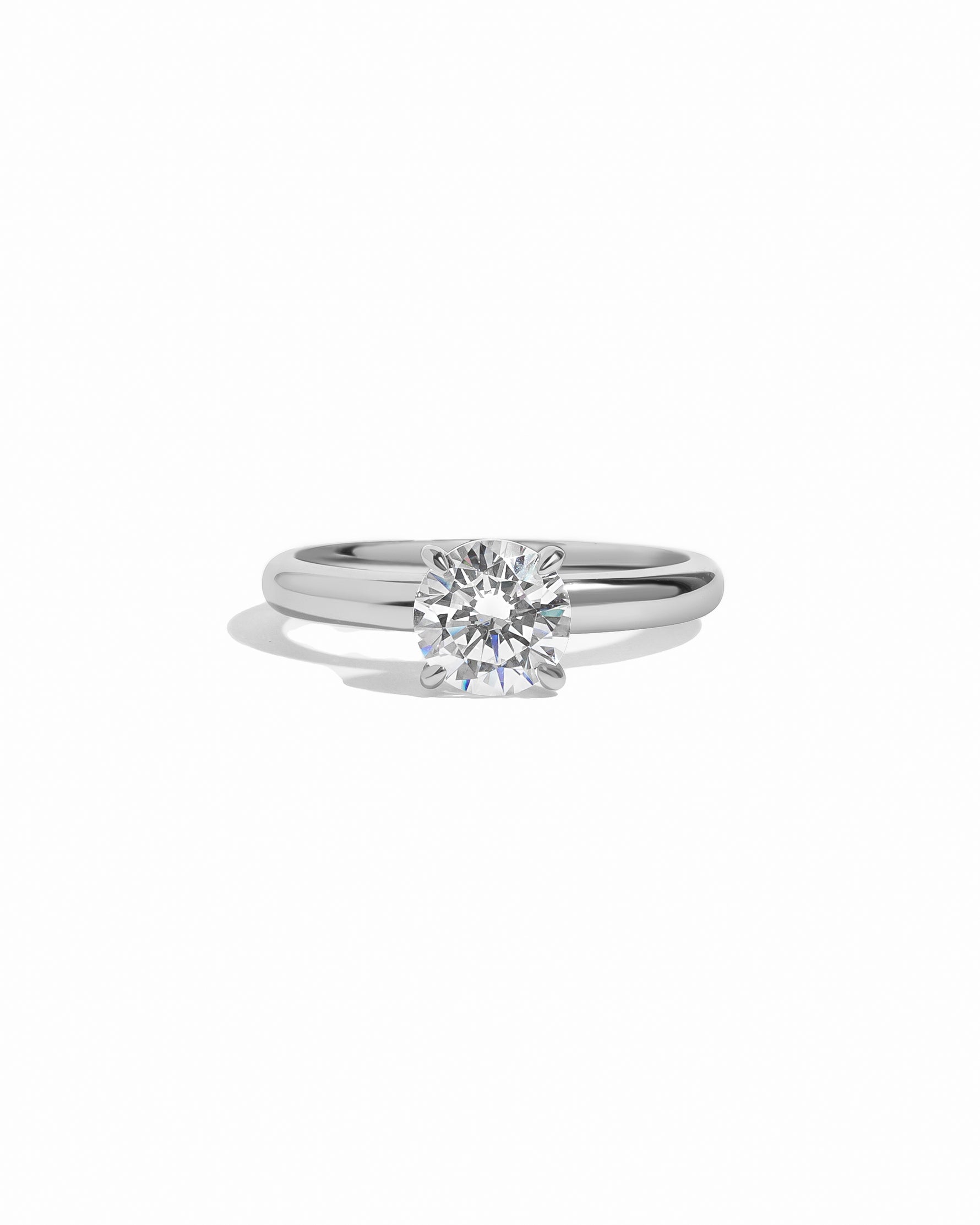 Sterling silver round solitaire ring by Sami Jewels displayed on a white background.