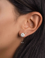 round solitaire stud earrings in gold in a 8mm on models ear