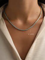 Round turquoise tennis necklace by Sami Jewels featuring gold chain and vibrant turquoise stones, 18-inch length.