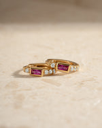 Gold Ruby Baguette Huggie Earrings from Sami Jewels, close-up view showing sparkling rubies and sleek gold design.