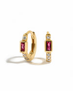 Gold Ruby Baguette Huggie Earrings by Sami Jewels featuring sparkling baguette-cut rubies on sleek gold hoops.