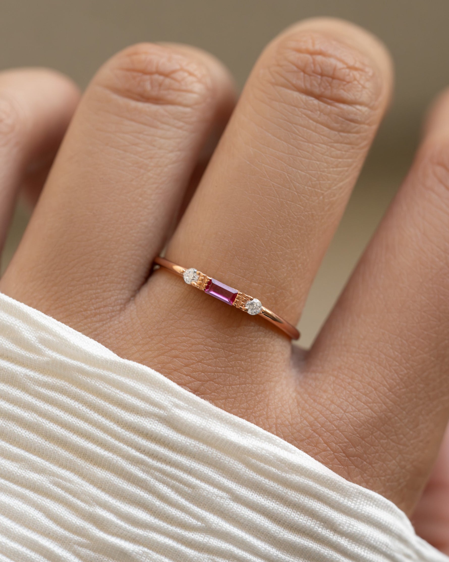 Sami Jewels Ruby Baguette Ring featuring a gold band with a striking rectangular ruby baguette gemstone.