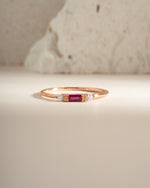 Rose gold Ruby Baguette Ring by Sami Jewels featuring a row of sparkling rectangular rubies on a sleek band.