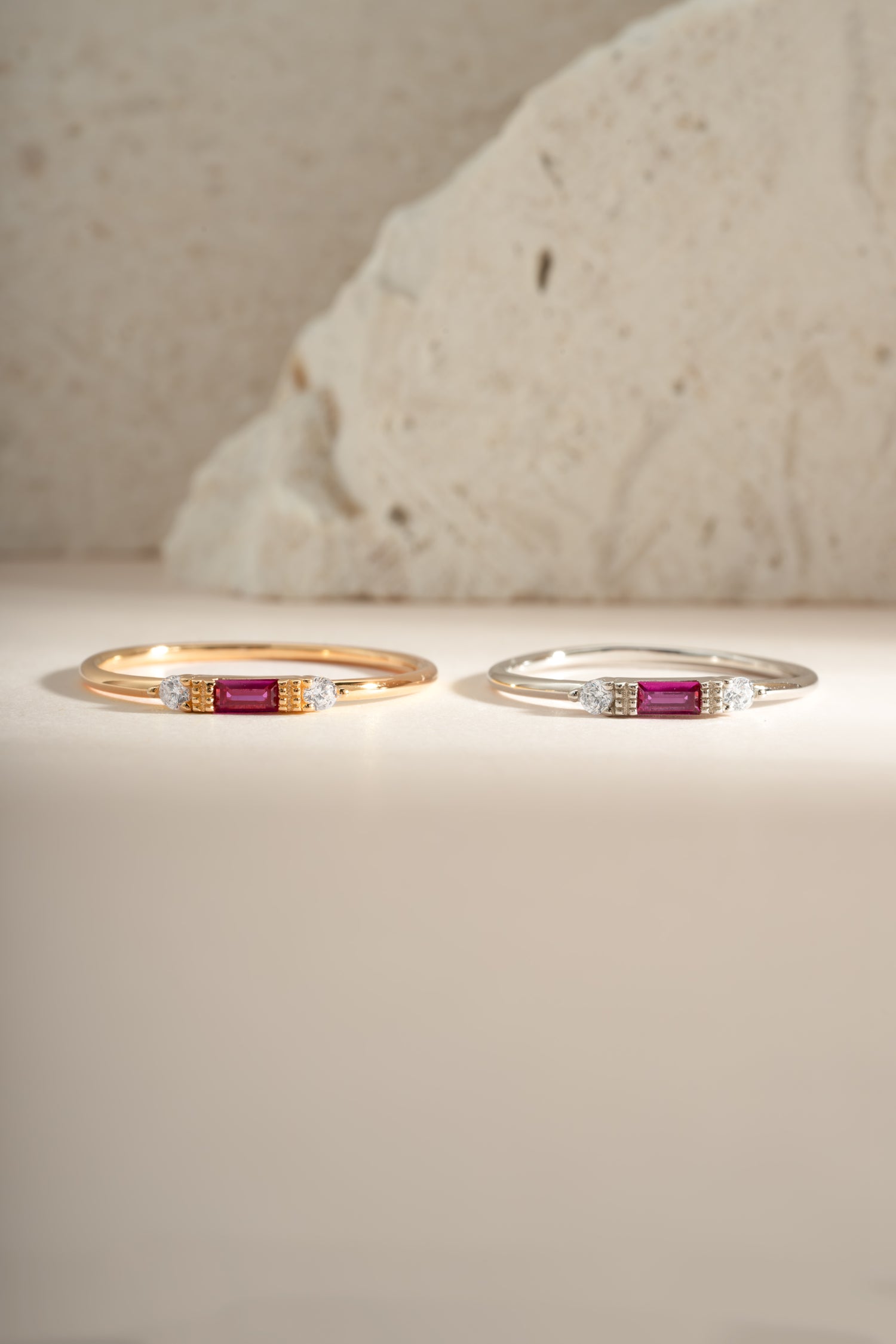 Sami Jewels Ruby Baguette Ring featuring a sterling silver and gold band with a vibrant rectangular ruby gemstone.