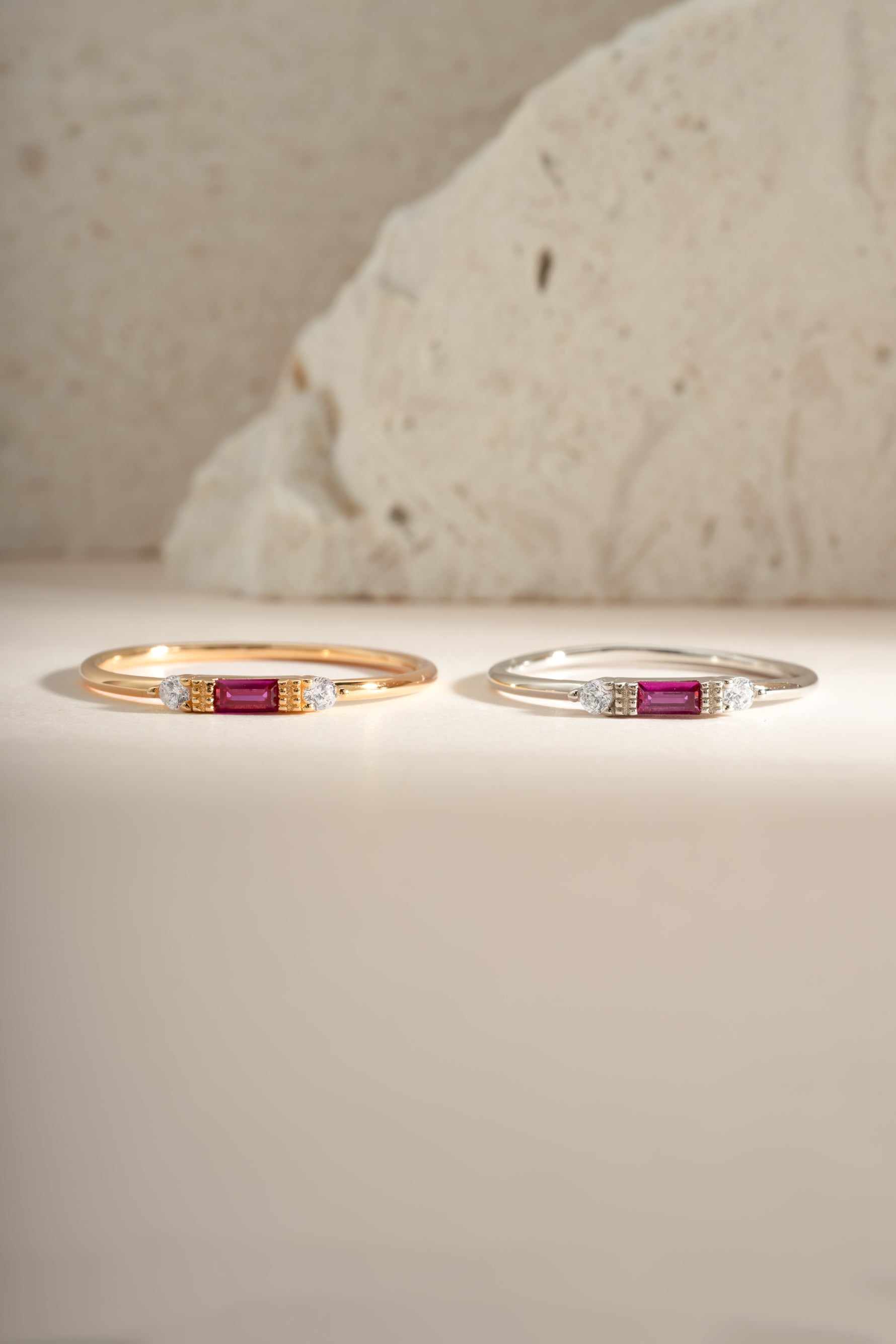 Sami Jewels Ruby Baguette Ring featuring a sterling silver and gold band with a vibrant rectangular ruby gemstone.
