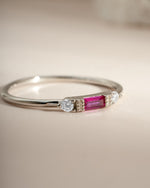 Sami Jewels Ruby Baguette Ring in sterling silver, angled view showcasing the elegant ruby baguette gemstone and sleek band design.
