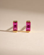 Gold Ruby Baguette Stud Earrings by Sami Jewels, front view showing rectangular red rubies set in elegant gold studs.