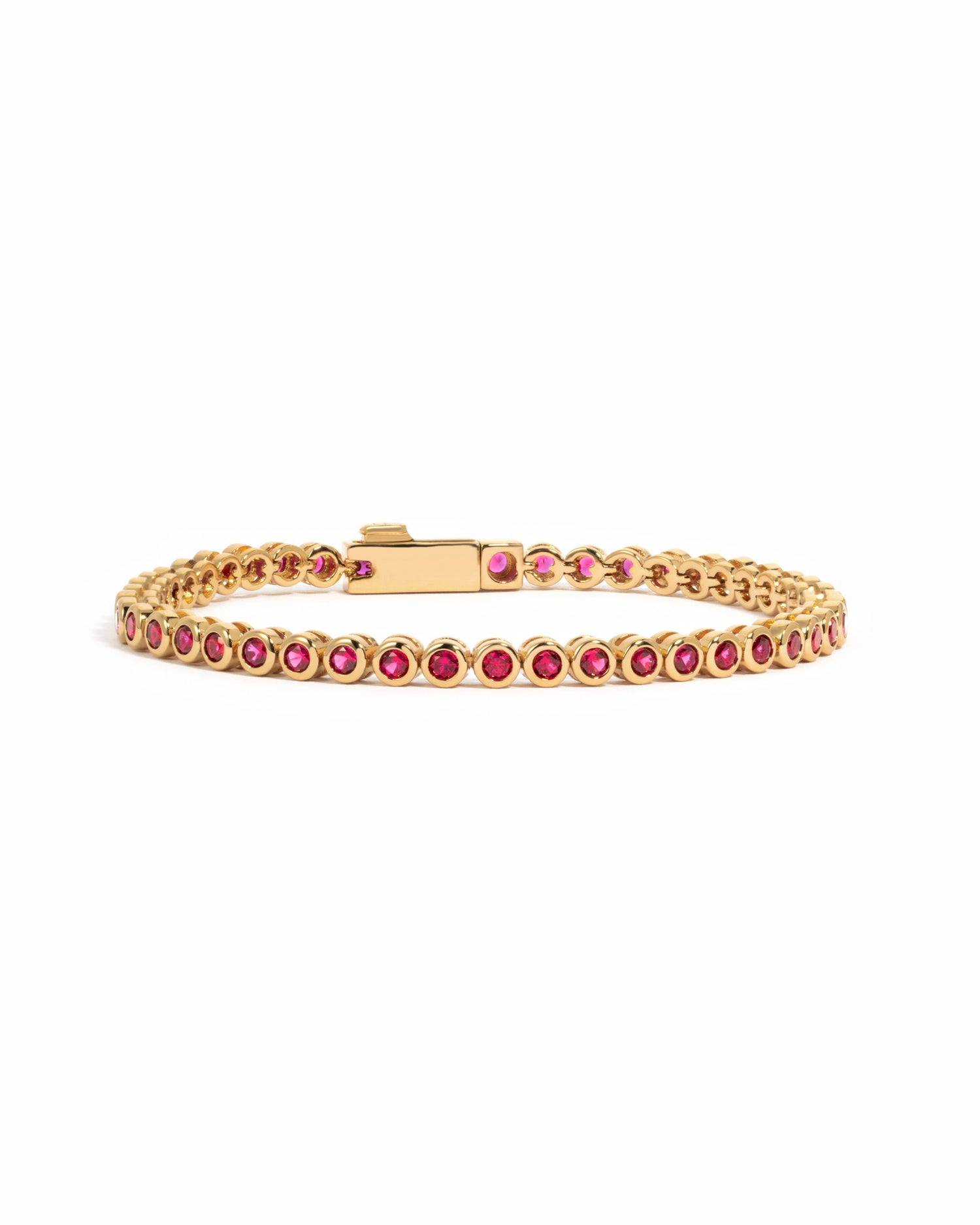 Gold Ruby Bezel Tennis Bracelet by Sami Jewels, featuring sparkling rubies set in a sleek gold design.