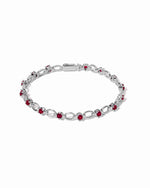 Silver Ruby Lilly Tennis Bracelet by Sami Jewels featuring a chain-link design with vibrant rubies.