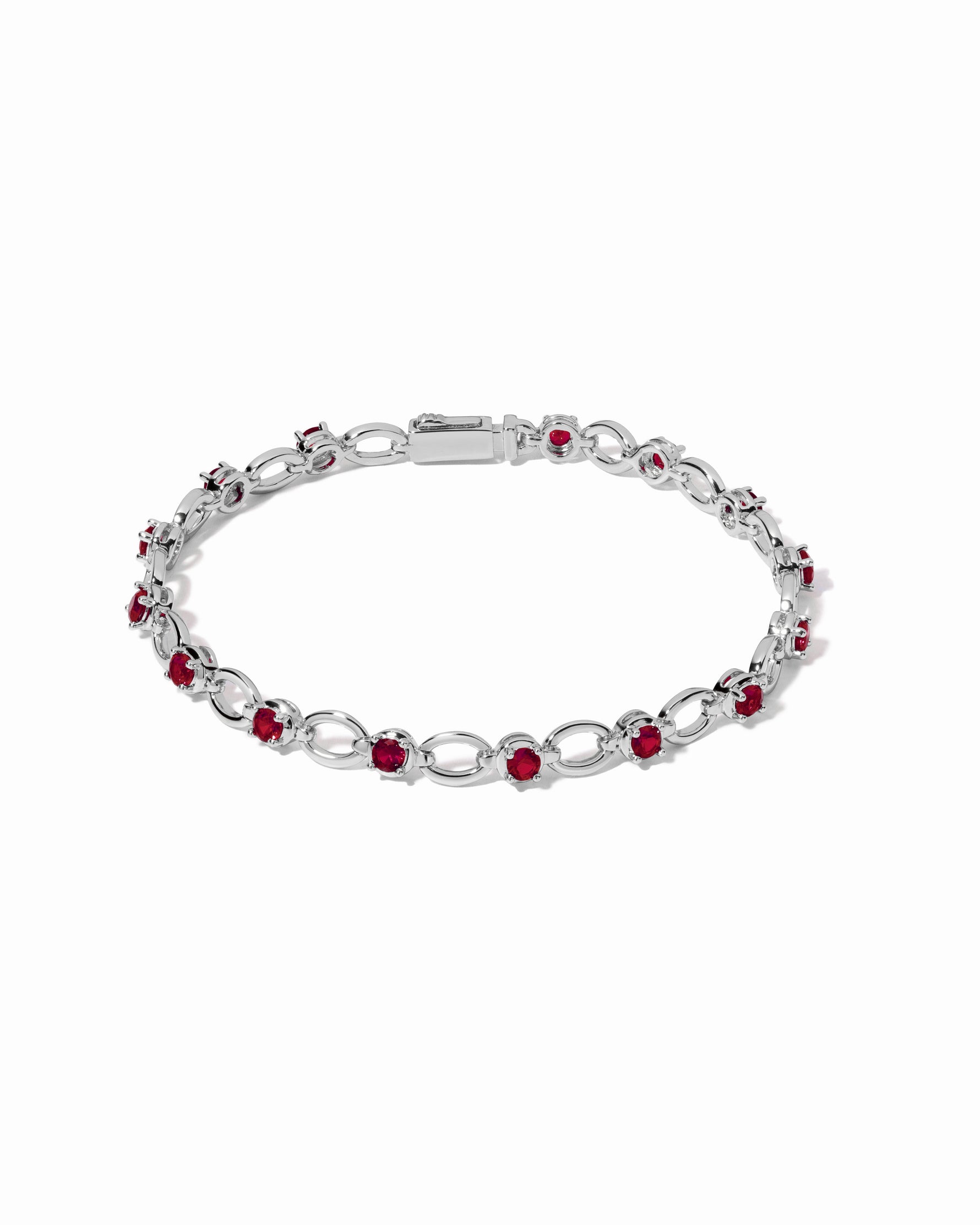 Silver Ruby Lilly Tennis Bracelet by Sami Jewels featuring a chain-link design with vibrant rubies.