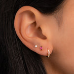 model wearing ruby birthstone earrings