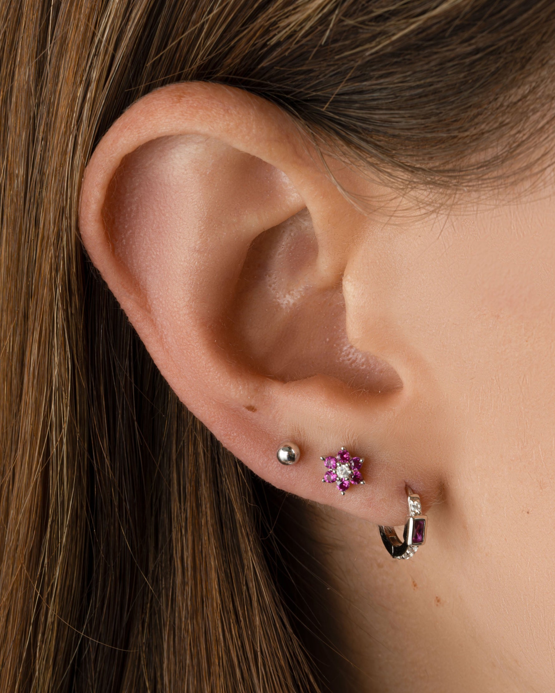 Sterling silver Ruby Flower Stud Earrings with CZ center stone by Sami Jewels, featuring vibrant red gemstone floral design.