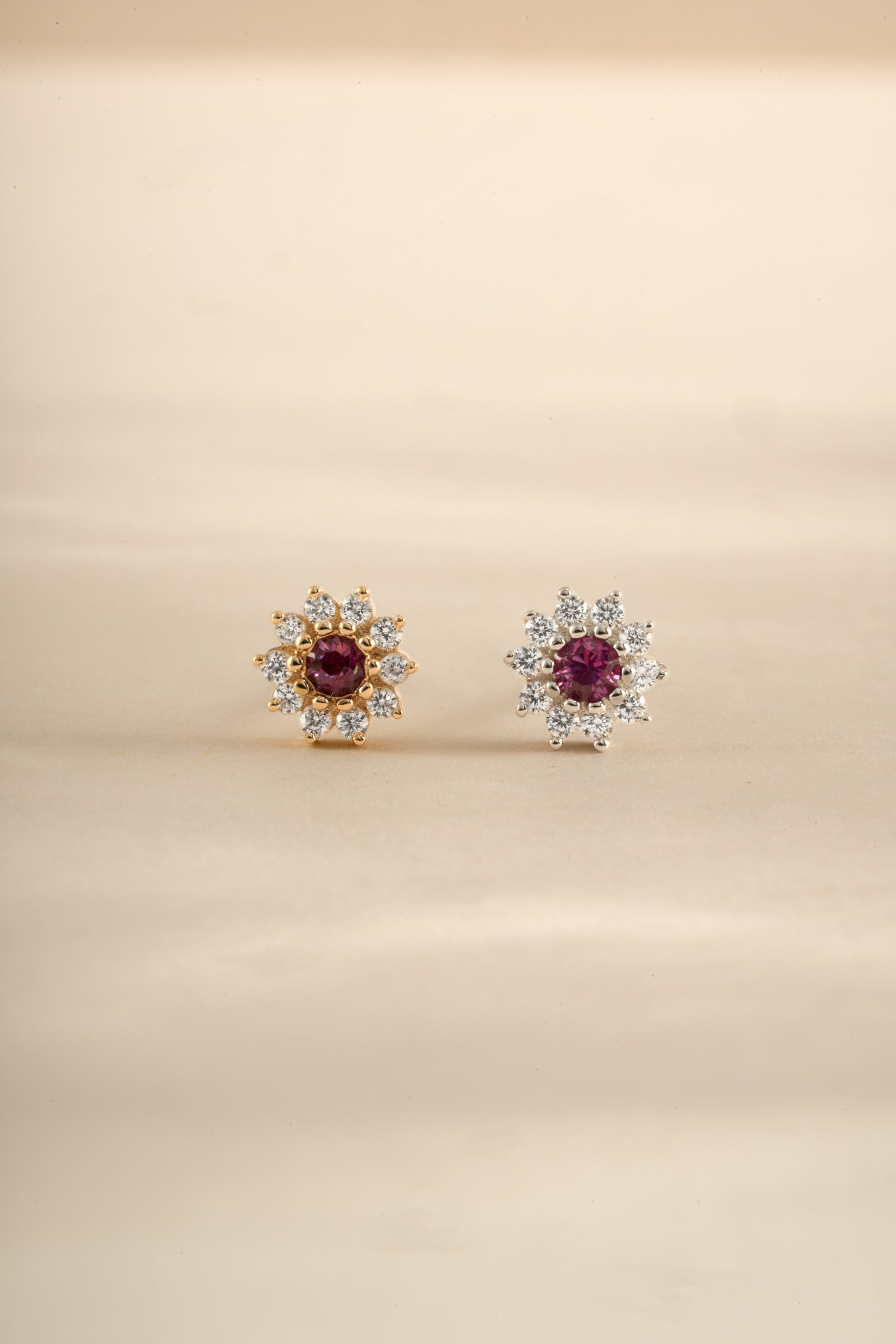 Silver and gold ruby dainty flower earrings by Sami Jewels featuring small floral stud design.