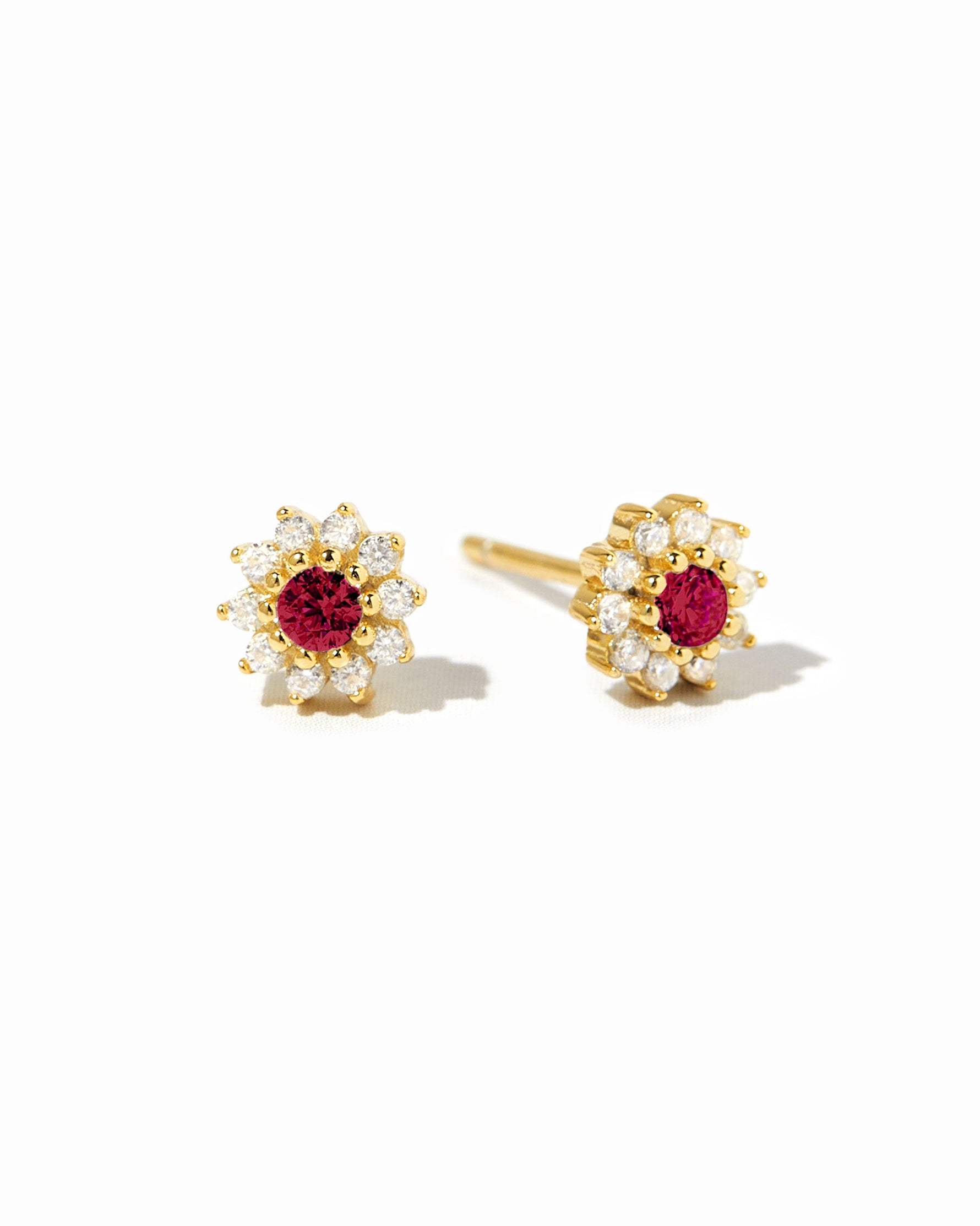 Gold Ruby Dainty Flower Stud Earrings by Sami Jewels displayed on a white background.