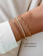 Gold Sami Jewels Ruby Bezel Tennis Bracelet with diamonds worn on a wrist, showcasing elegant jewelry design.